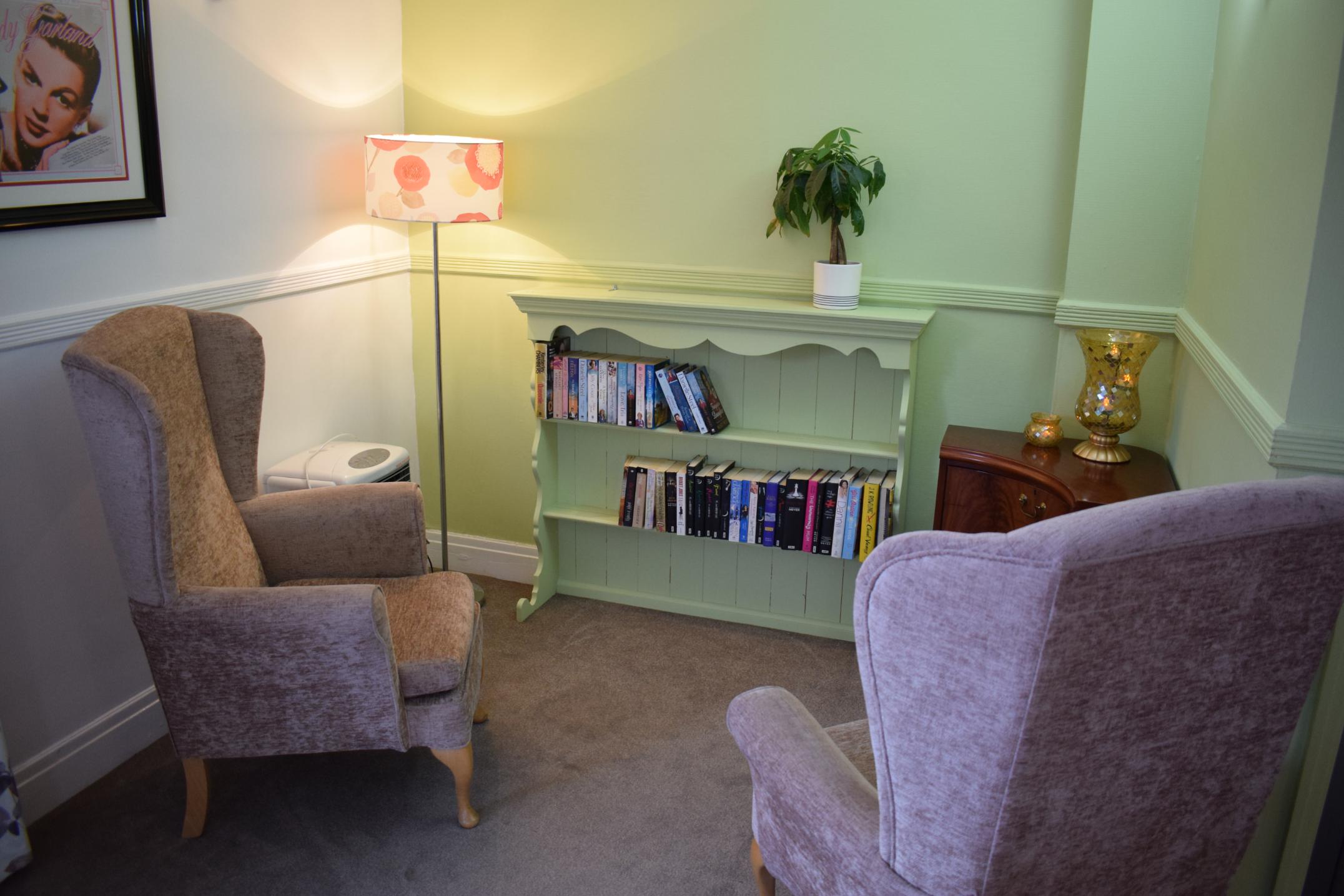 armchairs and bookshelf